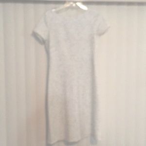 IVANKA TRUMP White dress with light grey and black linear design.